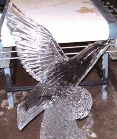 Eyes4ice melted ice sculpture of a bird in flight.